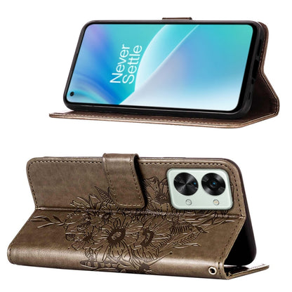 Grey folio leather phone case with embossed butterfly; stand-up viewing angle