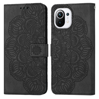 Black mandala embossed flip leather phone case with camera cutout and magnetic strap.