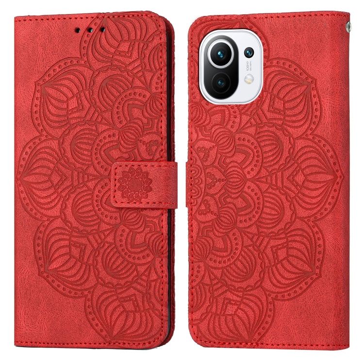 Red mandala embossed flip leather phone case with camera cutout and magnetic strap.