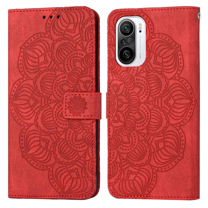 Red embossed flip leather phone case with mandala pattern and magnetic strap closure.