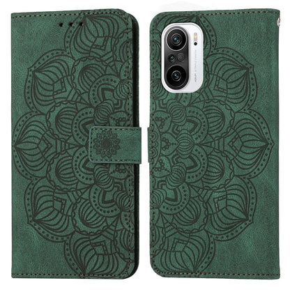 Green embossed flip leather phone case with mandala pattern and magnetic strap closure.