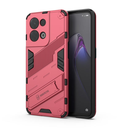 Rugged light red phone case with textured armor panels and camera cutouts