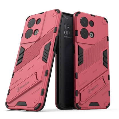 Rugged red phone case with textured armor panels, camera cutouts, and grip details