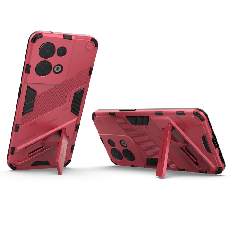 Rugged red phone case with kickstand, textured armor panels, and camera cutouts