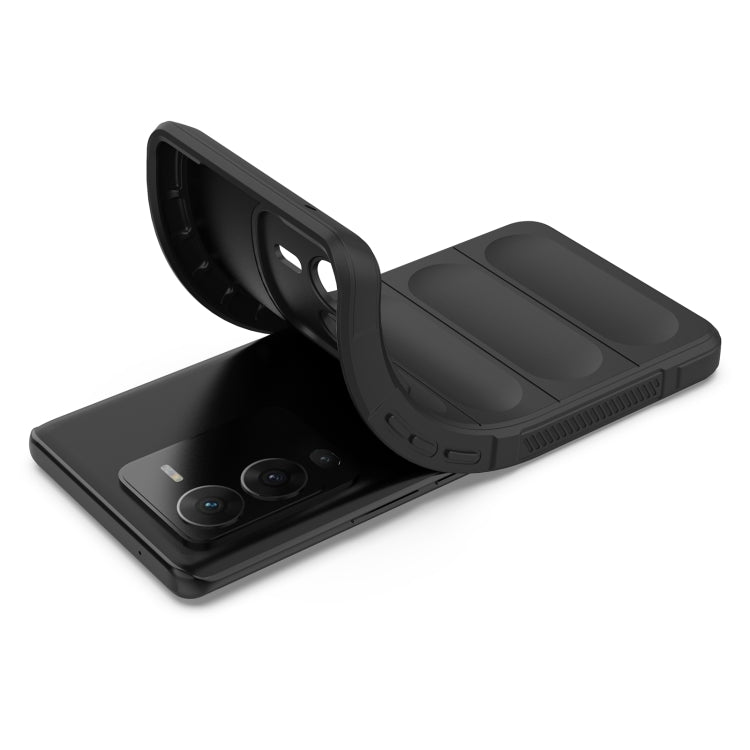 Rugged black phone case with foldable stand in open position