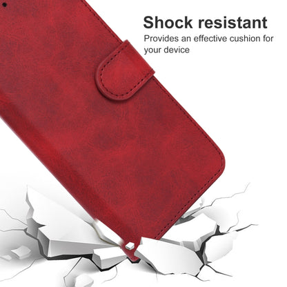 Red leather phone case with flip strap buckle and stitched edges