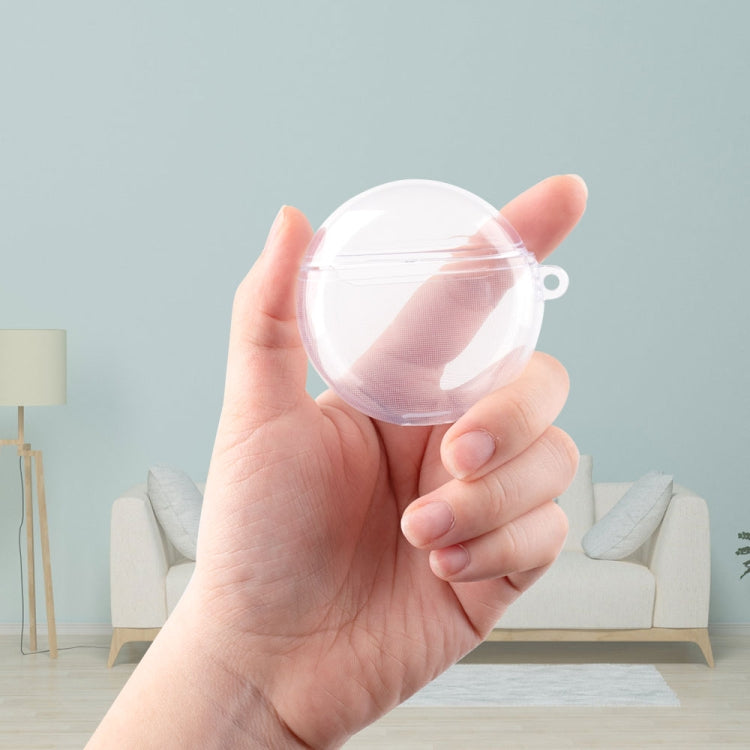 Clear transparent TPU earbud case held in hand, compact protective cover with loop