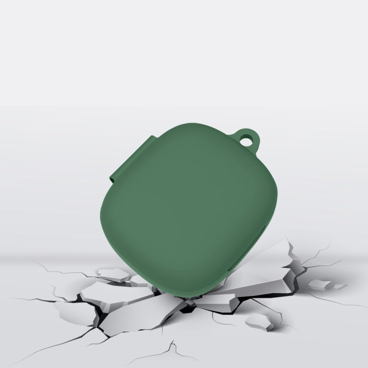 Green silicone earbud protective case for JBL Live Pro+ with loop top, on cracked base