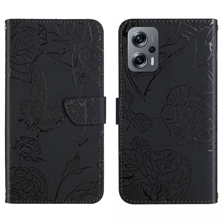 Black embossed butterfly-and-flower leather-look phone case with flip cover and camera cutout.