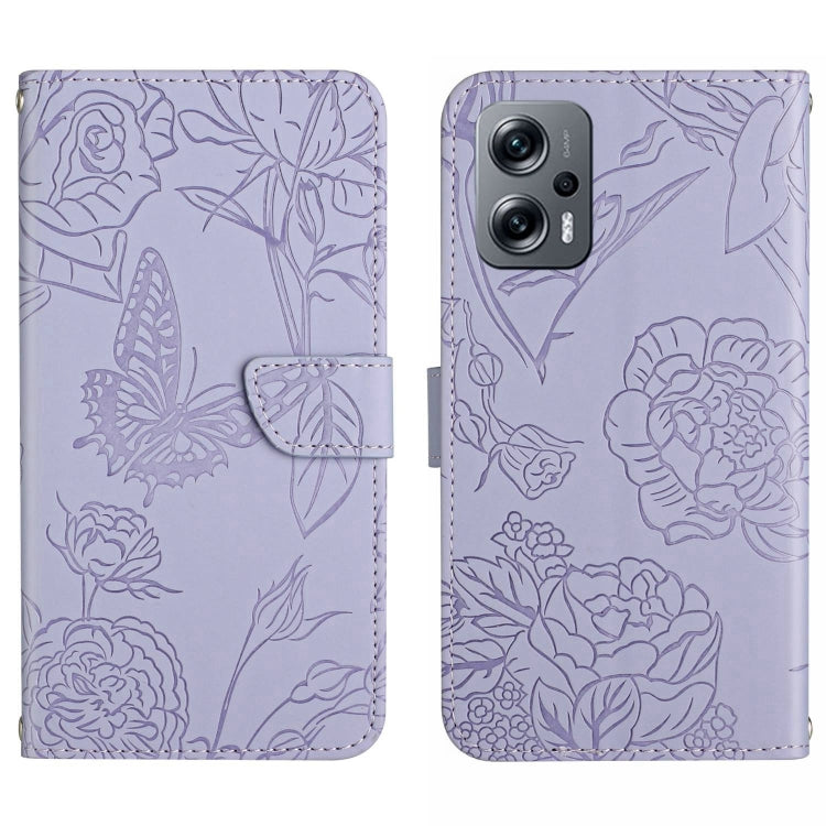 Lavender embossed butterfly-and-flower leather-look phone case with flip cover and camera cutout.