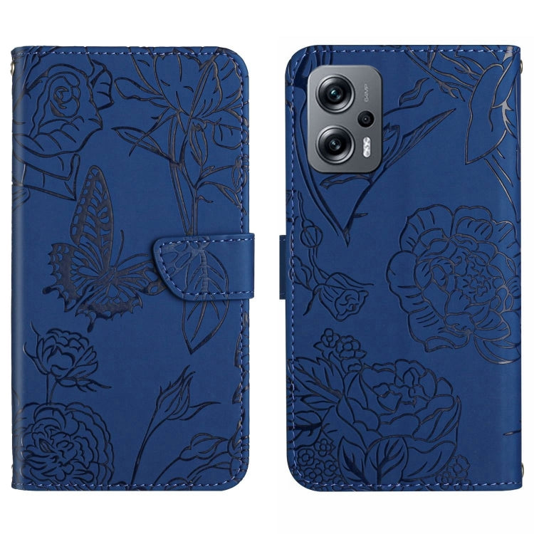 Blue embossed butterfly-and-flower leather-look phone case with flip cover and camera cutout.