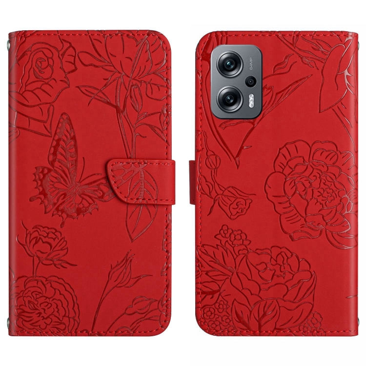 Red embossed butterfly-and-flower phone case back with dual-camera cutout and smooth edges.