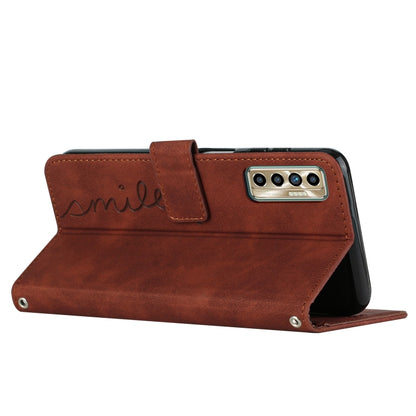 Brown leather folio phone case with heart pattern and foldable stand