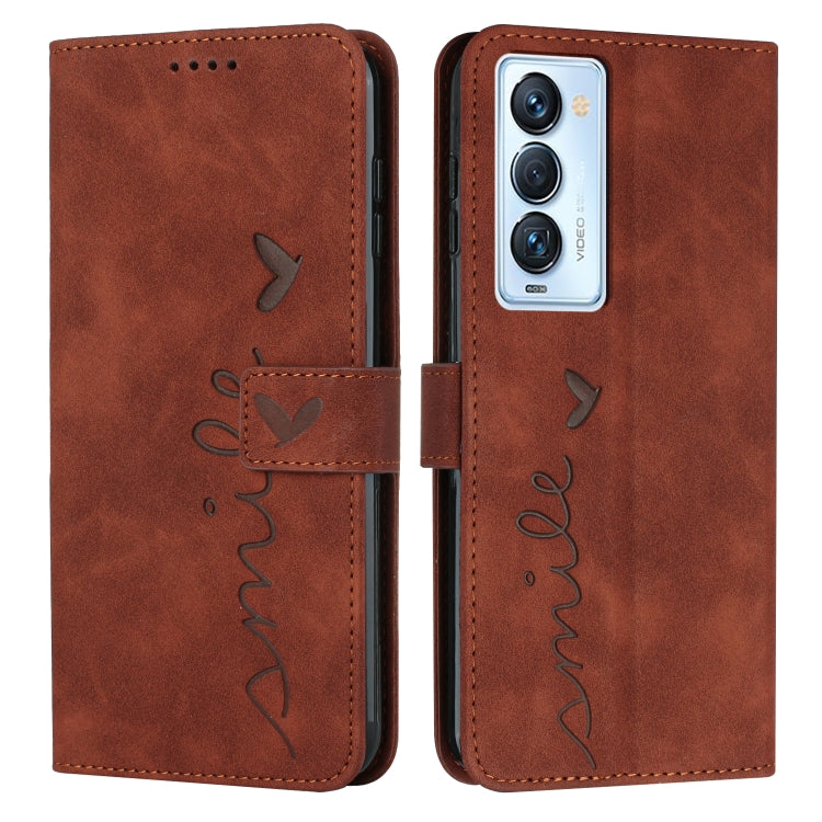 Brown leather wallet phone case with heart-and-bird line art, camera cutout front.