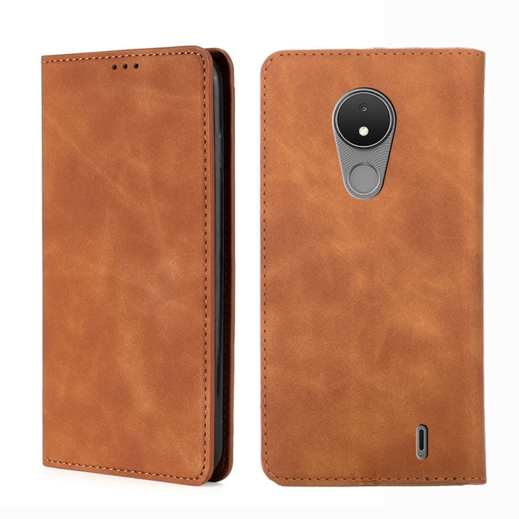 Leather magnetic flip phone case in light brown, with cutouts and stitched edges.