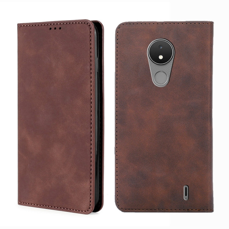 Leather magnetic flip phone case in dark brown, with camera and port cutouts.