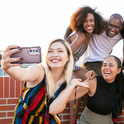People holding phones with a purple rugged case and pink accent details