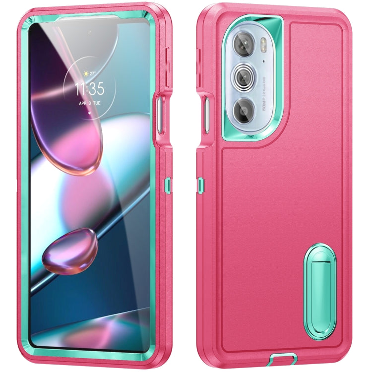 Rugged phone case in pink and teal, camera cutout and built-in stand