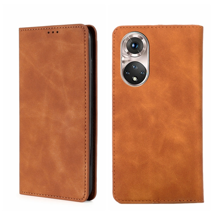 Magnetic flip leather phone case in light brown/tan with camera opening and stitched border.