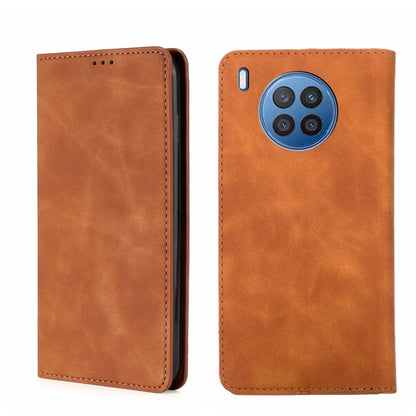 Light brown/tan magnetic flip leather phone case with multi-camera cutout and side port.