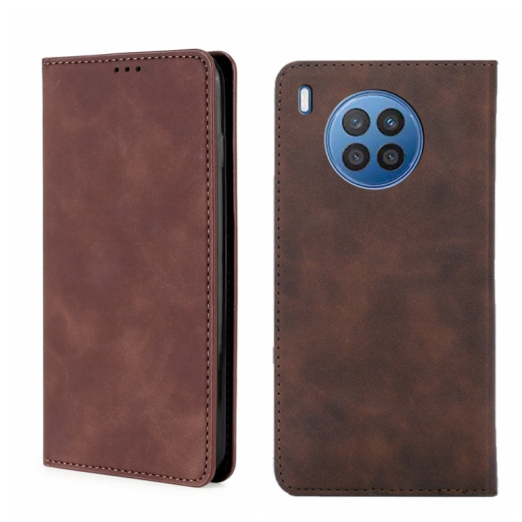 Dark brown magnetic flip leather phone case with multi-camera cutout and side port.