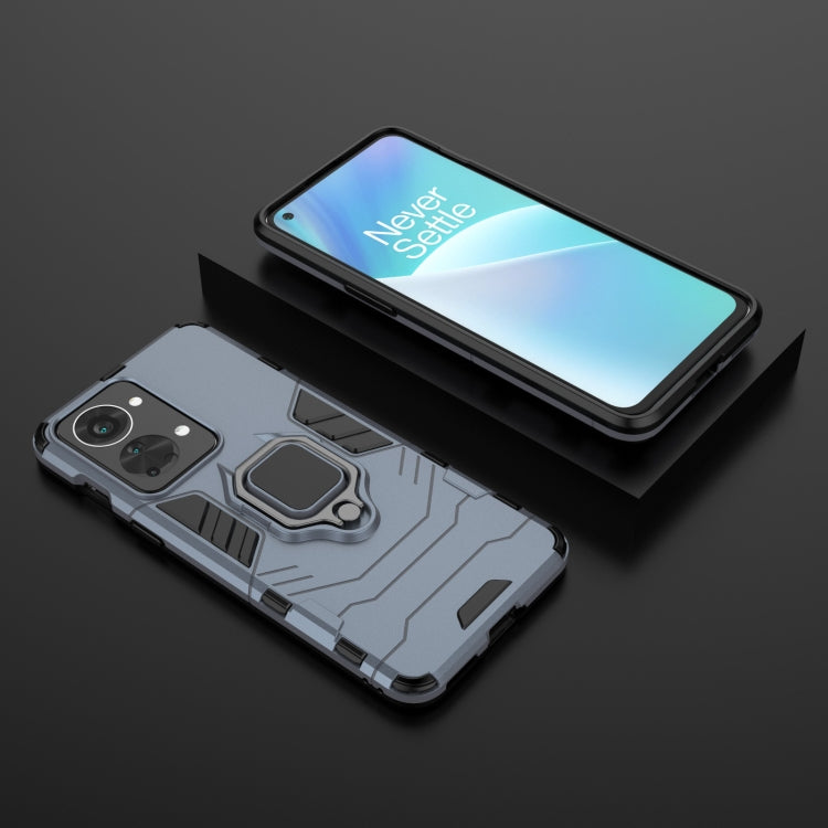 Rugged navy blue phone case with magnetic ring stand, front and back views, camera cutouts
