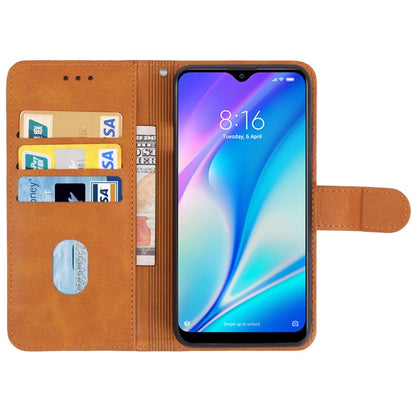 Brown leather wallet phone case with card slots and windowed phone holder, open