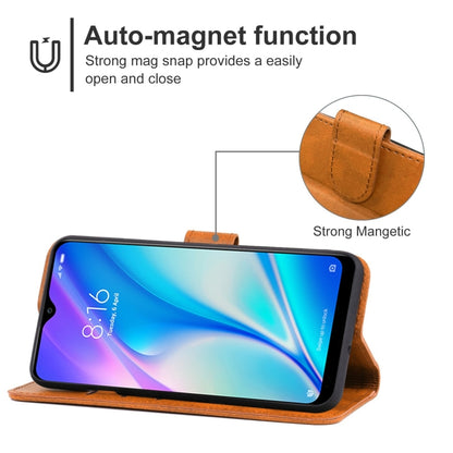 Brown leather phone case with flip cover and magnetic closure, shown in stand view