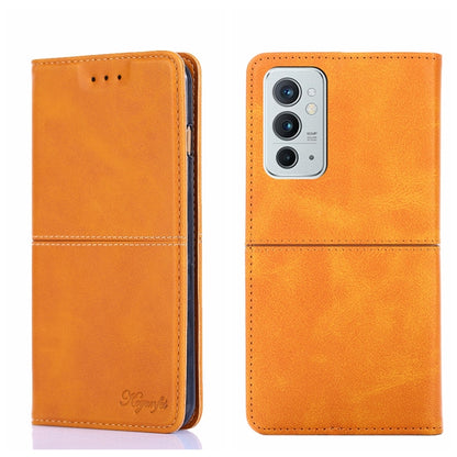 Magnetic flip leather phone case in orange with triple camera cutout and side seams.