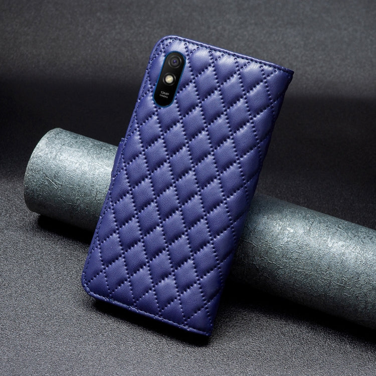Blue diamond-lattice leather flip phone case showing back panel texture