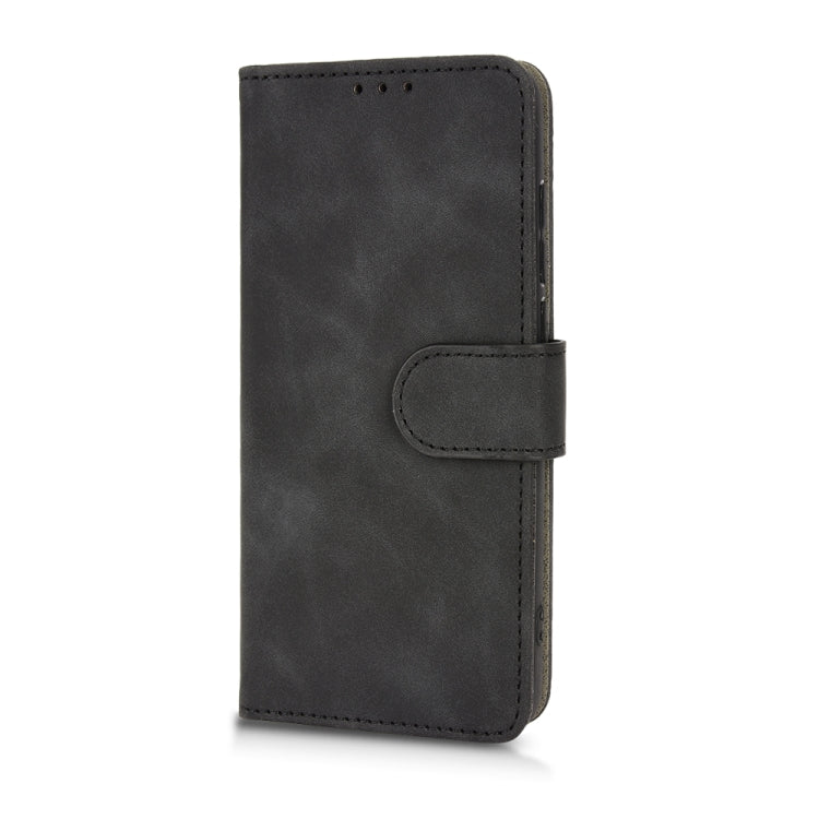 Black flip leather phone case with side magnetic strap and stitched closure panel.