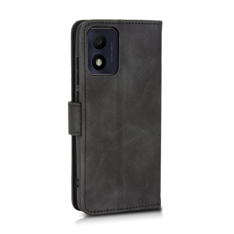 Black leather flip phone case with camera cutout and fold-over front cover.