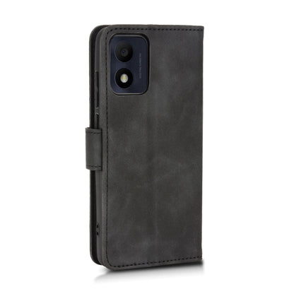 Black leather flip phone case with camera cutout and fold-over front cover.