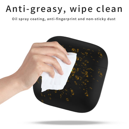 Black liquid silicone earphone protective case with carabiner, wiped clean with tissue