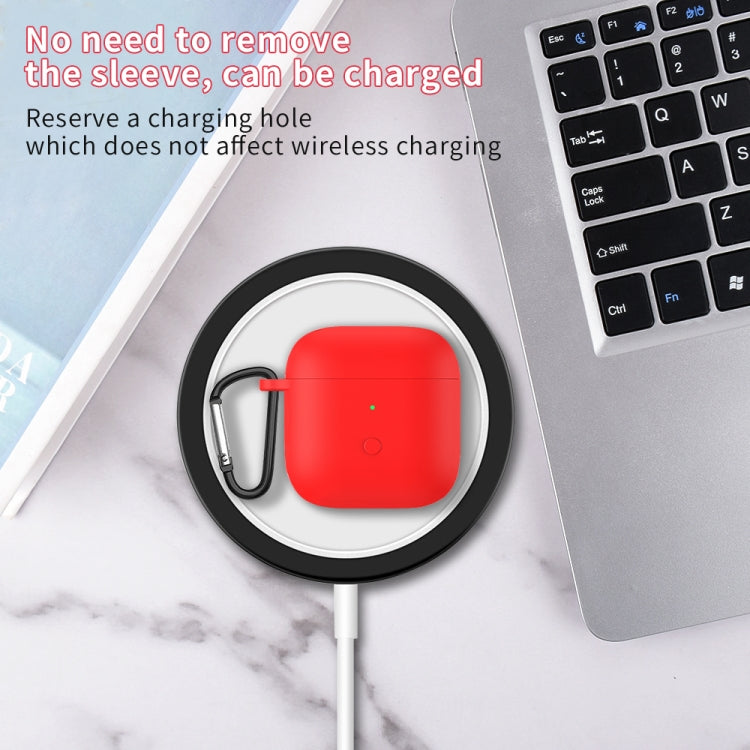 Red silicone earphone protective case with carabiner and charging port, on a white charging cable