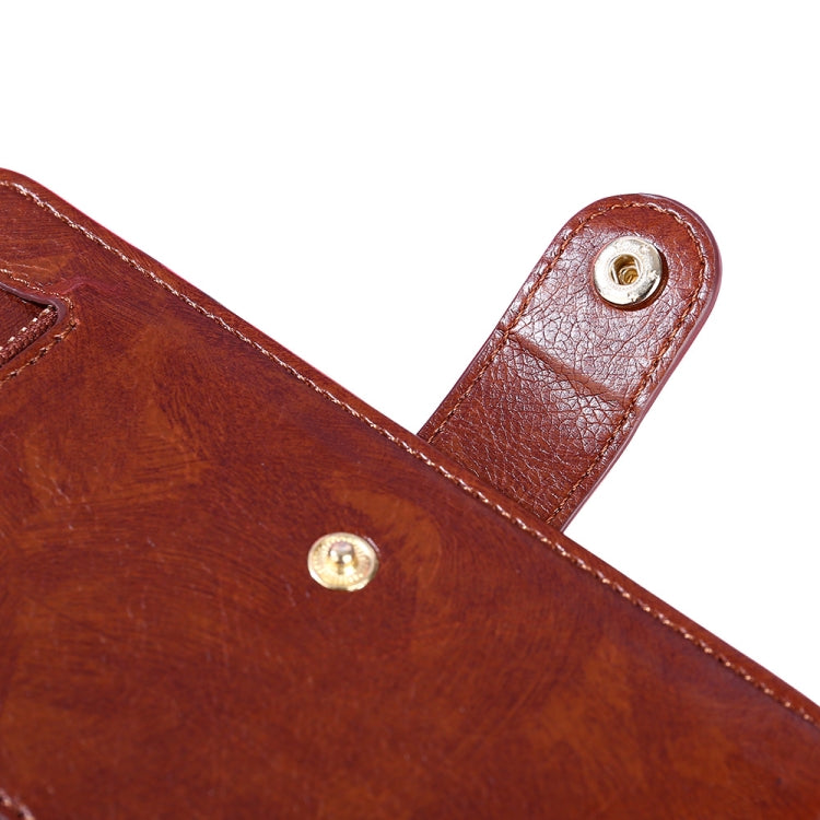 Brown leather zipper phone case strap and metal snap detail