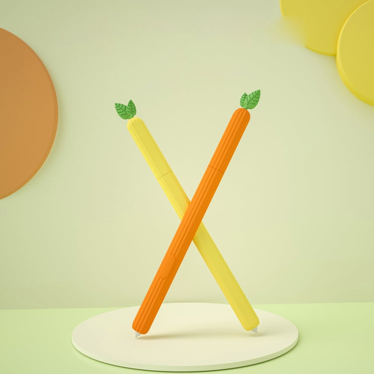 Two fruit-shaped silicone stylus protective cases, yellow and orange, on stand