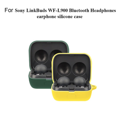 Silicone earphone protective case set: open green and yellow cases holding two earbuds.
