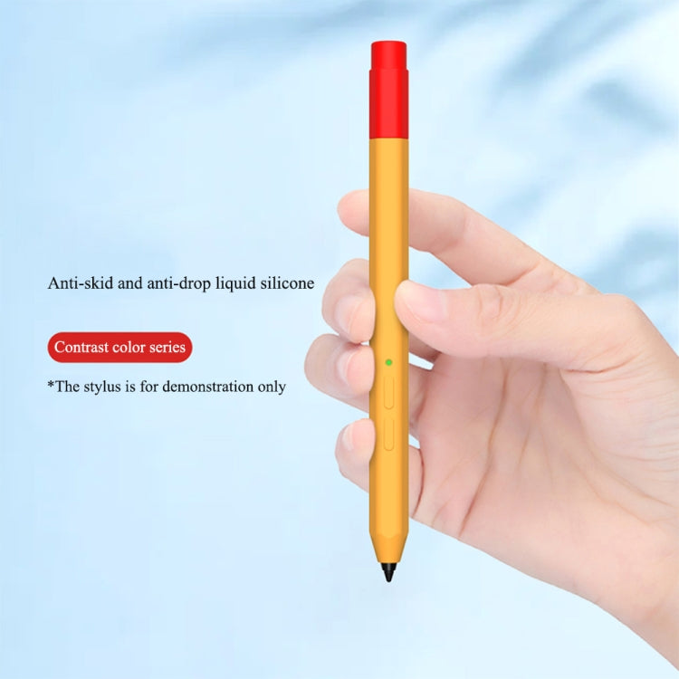 Orange liquid silicone stylus case with red top held in hand; green indicator visible.