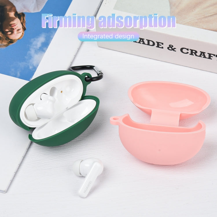 Dark green and pink liquid silicone earbud cases, open with earbuds inside