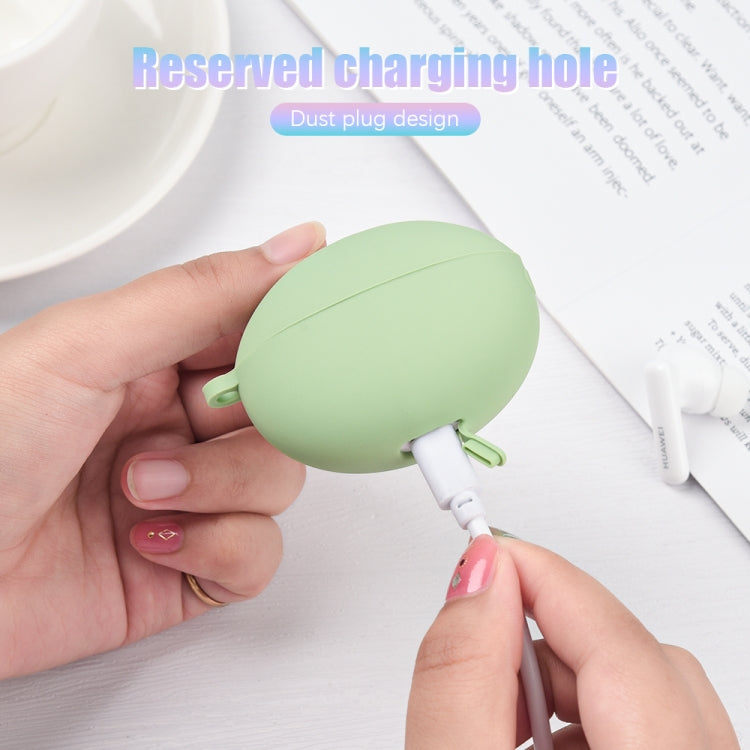 Light green silicone earbud case with charging port opening and dust plug