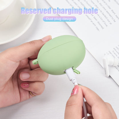 Light green silicone earbud case with charging port opening and dust plug