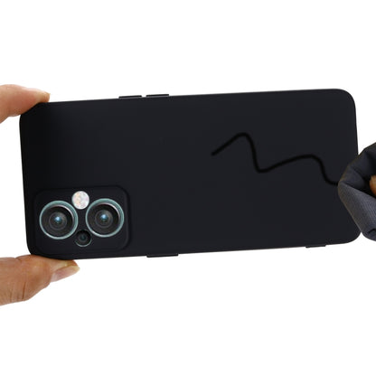 Shockproof full-coverage black phone case held in hand, showing side buttons cutout
