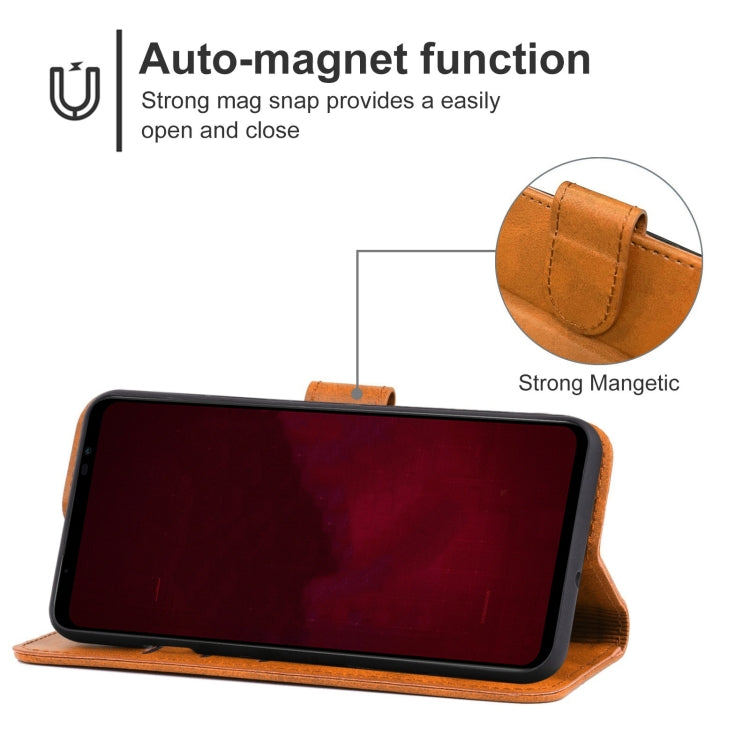 Brown leather flip phone case propped up as a viewing stand with magnetic closure.