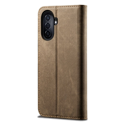 Khaki denim-texture leather phone case with camera cutouts and stitched trim.