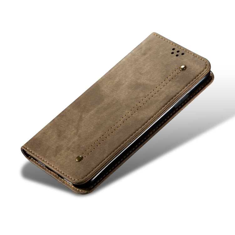 Khaki denim-texture leather phone case with magnetic button and stitched border.