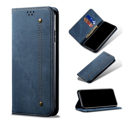 Blue denim-texture leather phone case with magnetic flap and card pocket detail.