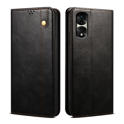 Black textured leather phone case with magnetic clasp, stitched edges, and camera cutout
