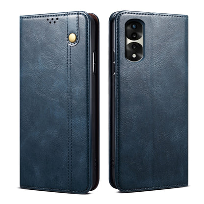 Blue leather phone case with magnetic clasp, stitched edges, and camera cutout
