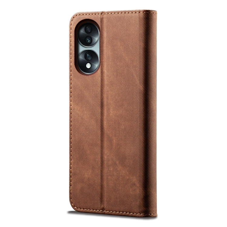 Brown denim-texture flip phone case with dual camera opening and stitched edges.